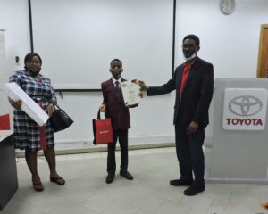 _Winner, 3rd Position 8 – 11 years category, Tamilore Daniel Awoyemi, GM (TNL) presenting him with his certificate and his mum holding his laptop prize